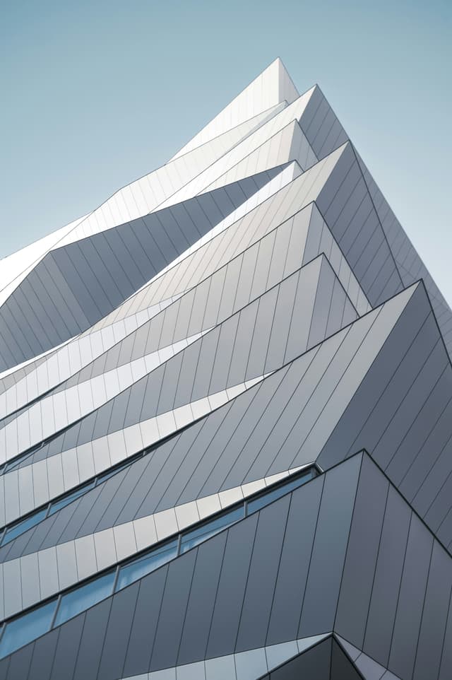 Geometric buildings resembling mountain peaks.